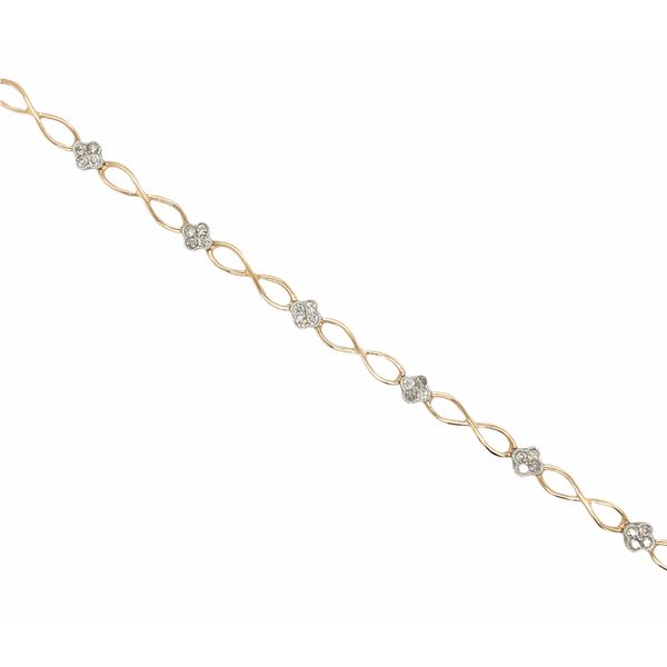 14k yellow and white gold bracelet featuring 0.50cttw round brilliant diamonds and infinity designs across the bracelet. Hudson Valley Goldsmith New Paltz, NY