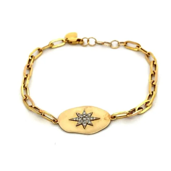 This 14Kt yellow gold paperclip style bracelet features a center oval satin disk with 0.10cttw diamonds hand set in a star pattern. The adjustable 6.5 - 7" bracelet adds a unique touch to any outfit. Hudson Valley Goldsmith New Paltz, NY