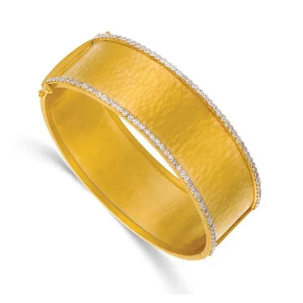 14k Yellow gold 21mm wide solid bangle with hammer finish and 0.45cttw natural diamonds bezel set in white gold on the top half rails of bracelet. Hudson Valley Goldsmith New Paltz, NY