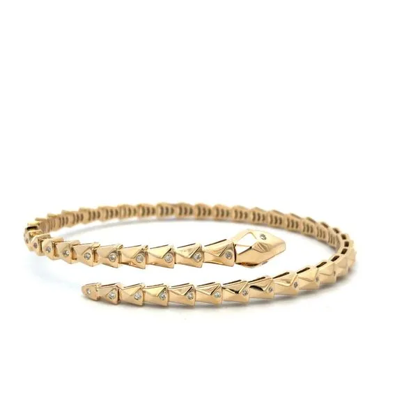 This 14Kt yellow gold snake wrap around open flex bracelet features 1/4ctw diamonds. A stunning piece for any woman's jewelry collection. Hudson Valley Goldsmith New Paltz, NY