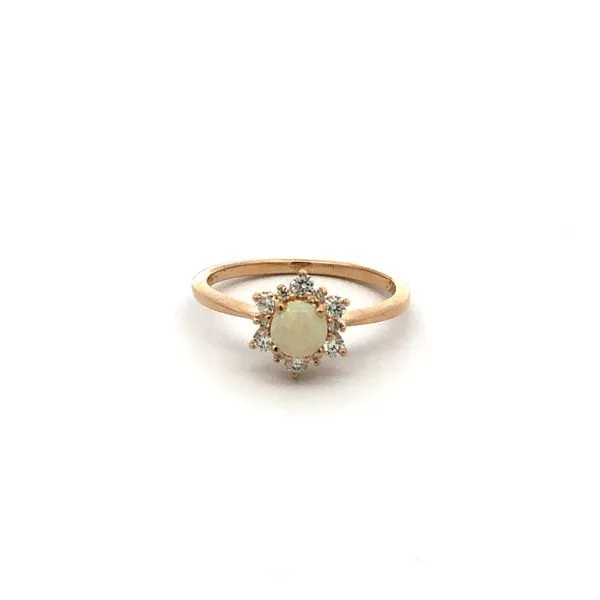 Crafted in 14K yellow gold, this ring features a mesmerizing oval opal center stone. Accented with 0.25 carats total weight of diamonds, this colored stone ring is a stunning choice for any occasion. Hudson Valley Goldsmith New Paltz, NY