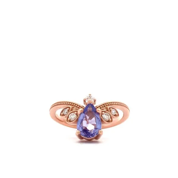 Crafted in 14K rose gold, this V ring showcases a beautiful purple tanzanite pear shaped center stone. Five small white diamonds add a touch of sparkle to this elegant colored stone ring. Hudson Valley Goldsmith New Paltz, NY