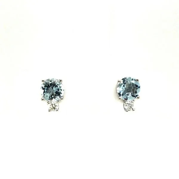 14k white gold post earrings featuring round brilliant aquamarine gemstones with 0.07cttw diamonds accented above the gemstones. Hudson Valley Goldsmith New Paltz, NY
