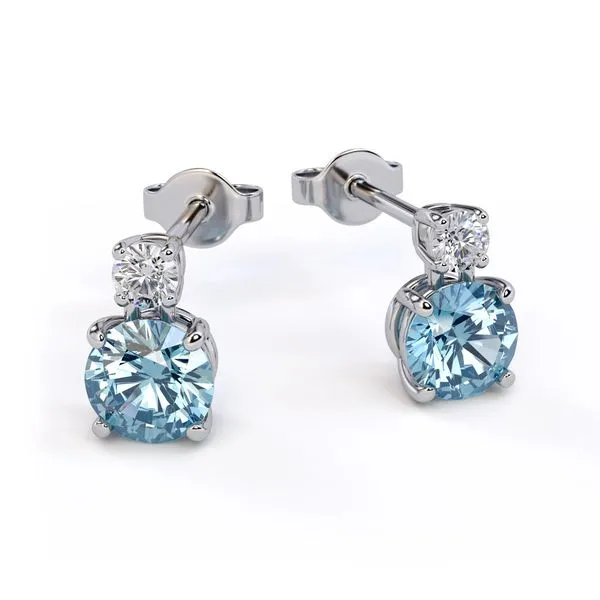These 14K White Gold Stud Earrings feature a round Blue Topaz gemstone and a small Diamond accent. The elegant design and high-quality materials make these earrings a perfect choice for any occasion. The blue topaz adds a touch of color and sparkle to you Hudson Valley Goldsmith New Paltz, NY