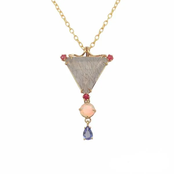 14k yellow gold custom pendant featuring triangular tourmilated quartz center gemstone and accenting three round ruby gemstones. Hudson Valley Goldsmith New Paltz, NY