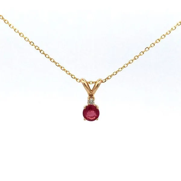 This 14k yellow gold necklace features a round ruby gemstone and a 0.02 carat diamond accent. The necklace comes with an 18" diamond cut cable chain, adding extra sparkle to the piece. It's a perfect accessory for women who love vibrant and eye-catch Hudson Valley Goldsmith New Paltz, NY