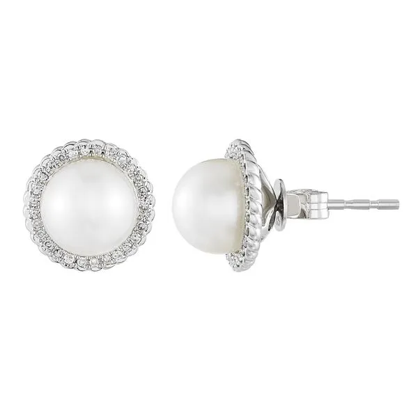 These 14k White Gold Pearl Studs feature a white freshwater pearl surrounded by a halo of 0.16ctw round single cut diamonds. The Hudson Valley Goldsmith New Paltz, NY