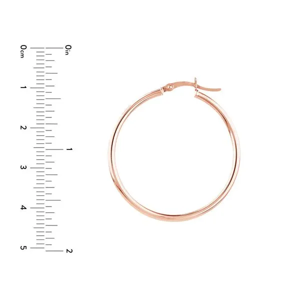 Make a statement with these 14K rose gold large round hoop earrings. The 35 x 2mm size makes these earrings a bold and eye-catching accessory. Made with high-quality 14K rose gold, these earrings are durable and long-lasting. The large round shape adds a  Image 3 Hudson Valley Goldsmith New Paltz, NY