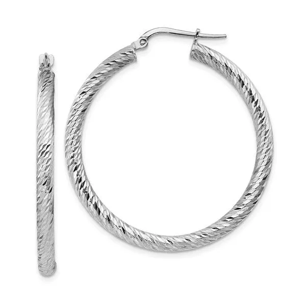 These 14k white gold diamond-cut round hoop earrings are a classic addition to any jewelry collection. The hoops are polished to a high shine and feature a diamond-cut design that adds a touch of sparkle. With a 3mm width, these earrings are lightweight a Hudson Valley Goldsmith New Paltz, NY