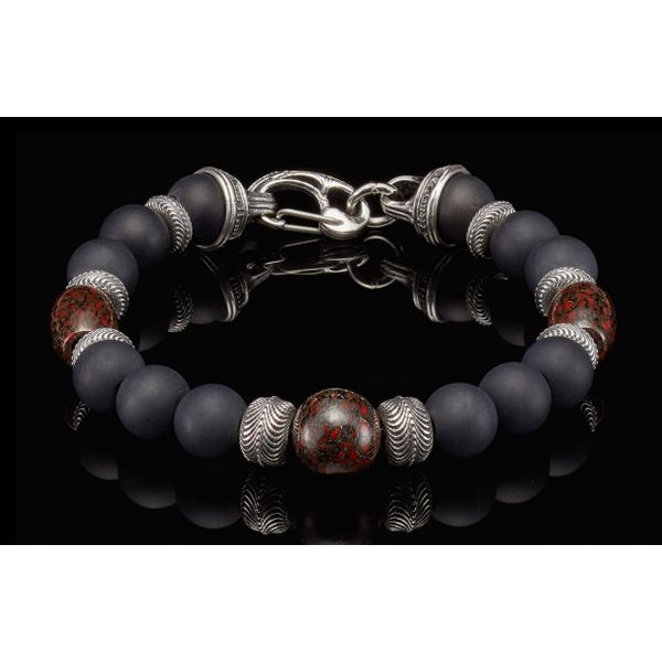 History comes to life in this beautiful bracelet. The 'Magma' features three matching beads crafted from fossil dinosaur bone, t Hudson Valley Goldsmith New Paltz, NY