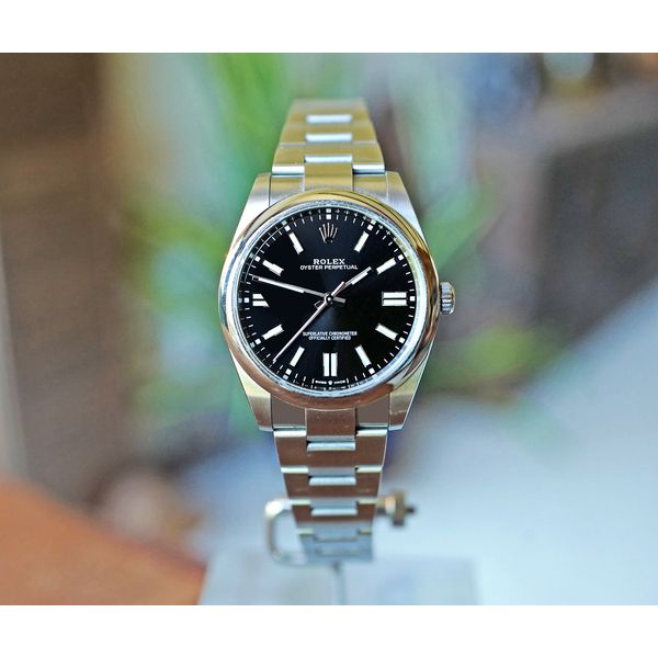 Rolex Oyster Perpetual 41 Black Sunray Dial Stainless Steel 41mm Watch Ref. 124300 Preowned Huffords Jewelry Frontenac, MO