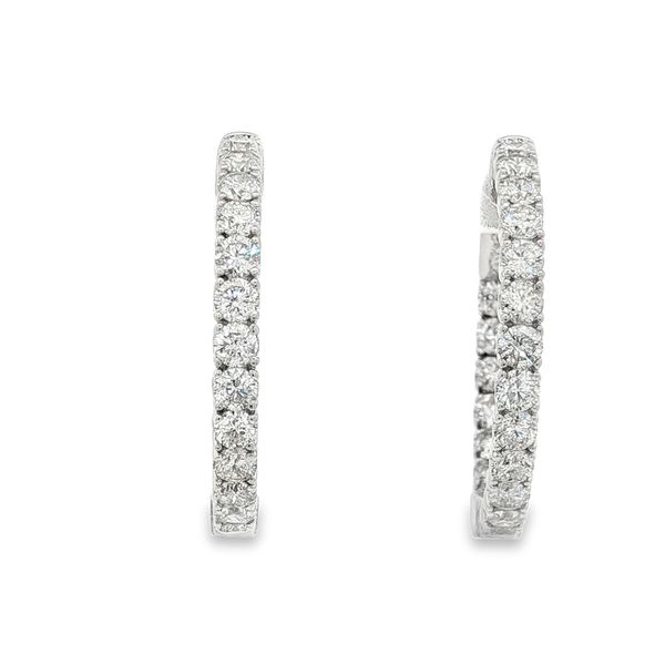 These earrings feature 2.80cttw of round brilliant cut diamonds prong set in a 14k white gold Inside-Out hoop Jaymark Jewelers Cold Spring, NY