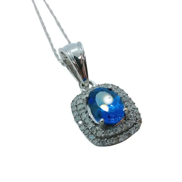 Tanzanite and Diamond Halo Necklace Image 2 Joint Venture Jewelry Cary, NC