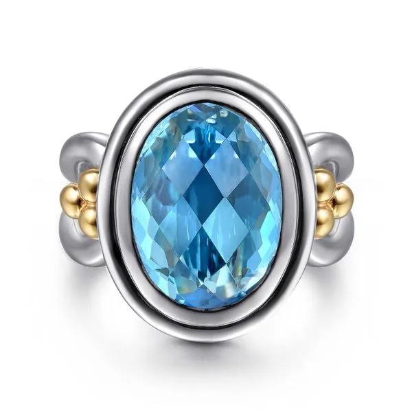 14K Yellow Gold and 925 Sterling Silver Bujukan Oval Blue Topaz Cocktail Ring Koerbers Fine Jewelry Inc New Albany, IN