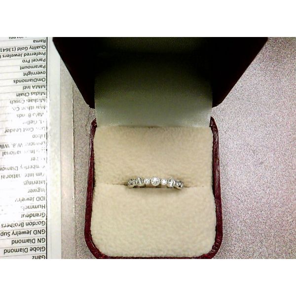 14KWG DIAMOND BAND CONTAINING 11 ROUND MILGRAIN BEZEL SET DIAMONDS  .34CTTW Lennon's W.B. Wilcox Jewelers New Hartford, NY