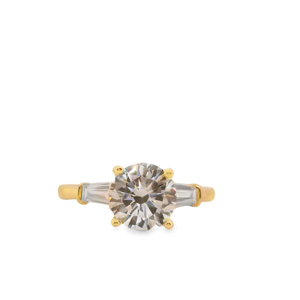 Yellow 14 Karat Ring Size 6.5 With One 1.50Ct Round Cubic Zirconium And 2 0.50Tw Tapered Baguettes G/H Diamonds Lennon's W.B. Wilcox Jewelers New Hartford, NY