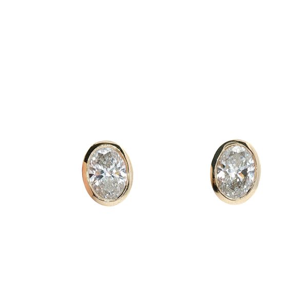 14KY LAB GROWN DIAMOND STUD EARRINGS, WITH 2 OVAL  CUT DIAMONDS IN A BEZEL SETTING, AND A HIDDEN HALO CONTAINING ROUND LAB GROWN DIAMONDS <br>TOTAL WEIGHT = 3.29CTTW Lennon's W.B. Wilcox Jewelers New Hartford, NY