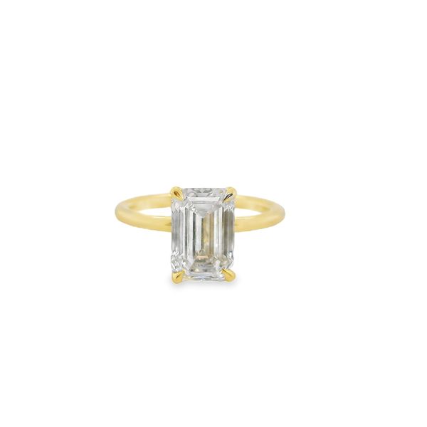 3.01 CT EMERALD CUT LAB GROWN DIAMOND SET IN 14K YG 4-PRONG SETTING WITH A HIDDEN HALO .13CTTW RND DIAS.  <br>IGI CERT #  LG751501141 Lennon's W.B. Wilcox Jewelers New Hartford, NY