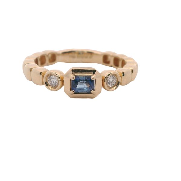 14K YG FASHION RING WITH "EAST - WEST" EMERALD CUT SAPPHIRE .27 CT SET IN 4 PRONGS IN CENTER AND A ROUND DIAMOND ON EACH SIDE .08 CTTW<br>SHANK IS MADE UP OF ROUNDED SQUARES Lennon's W.B. Wilcox Jewelers New Hartford, NY