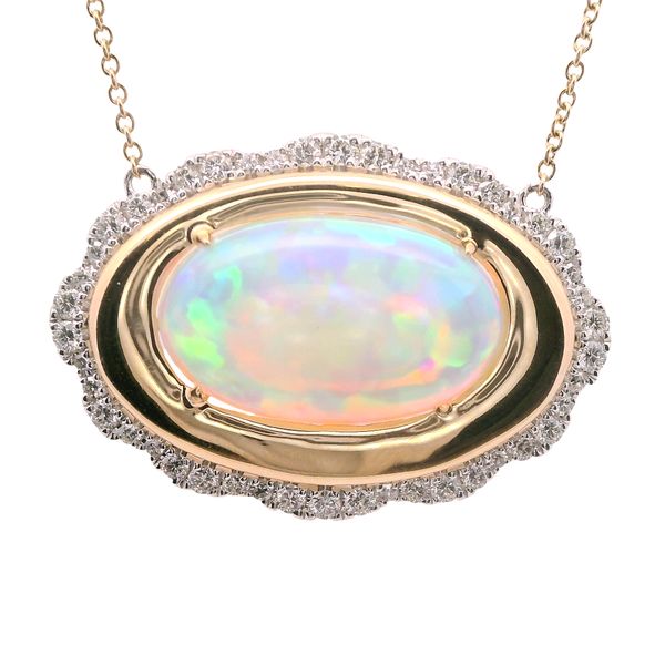 14K PENDANT CONTAINING ONE 5.73 CT OVAL OPAL, SET EAST- WEST  SURROUNDED BY DIAMONDS SET IN 14K WG  DIA. WT = .63 CTTW ON 18" CHAIN WITH 4 BEZEL SET DIAMONDS .11 CTTW Lennon's W.B. Wilcox Jewelers New Hartford, NY