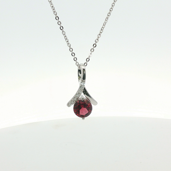 1.53CT ROUND GARNET PENDANT WITH 0.18CTW WHITE TOPAZ ACCENTS Lester Martin Dresher, PA