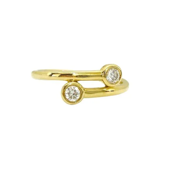 Bezel-set diamond bypass ring.