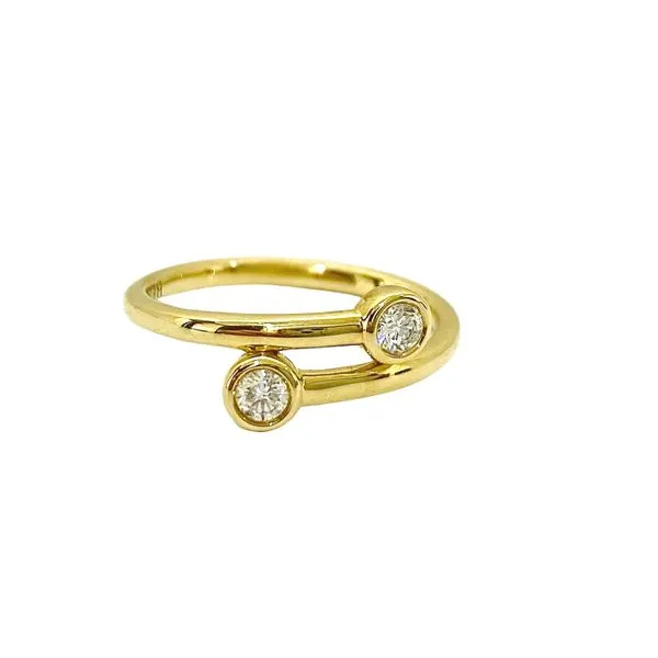 Bezel-set diamond bypass ring.