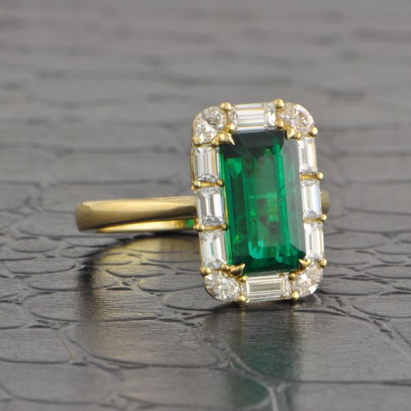Elongated Emerald and Diamond Halo Ring in Yellow Gold Image 2 Perry's Diamonds & Estate Jewelry Charlotte, NC