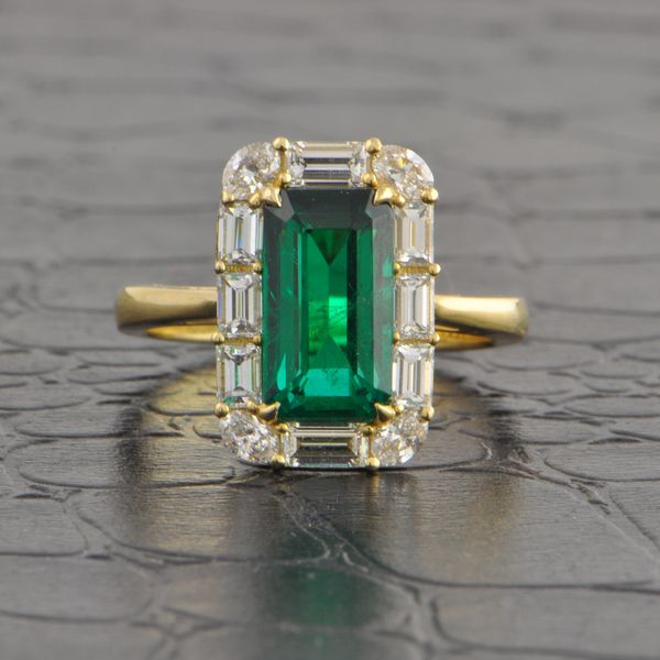 Elongated Emerald and Diamond Halo Ring in Yellow Gold Perry's Diamonds & Estate Jewelry Charlotte, NC