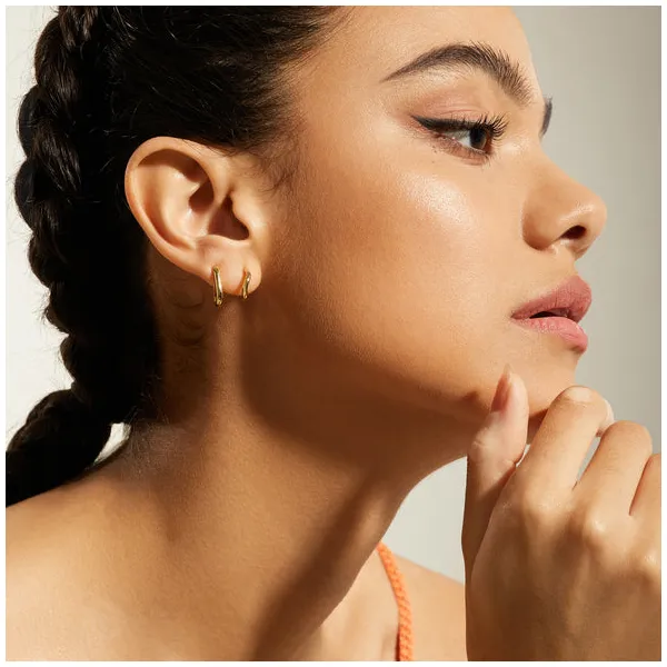 Ania Haie Gold Twist Huggie Hoop Earrings Image 2 Peter & Co. Jewelers Avon Lake, OH