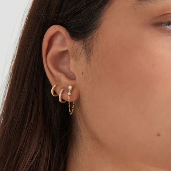 Ania Haie Gold Smooth Mini Huggie Hoop Earrings Image 2 Peter & Co. Jewelers Avon Lake, OH