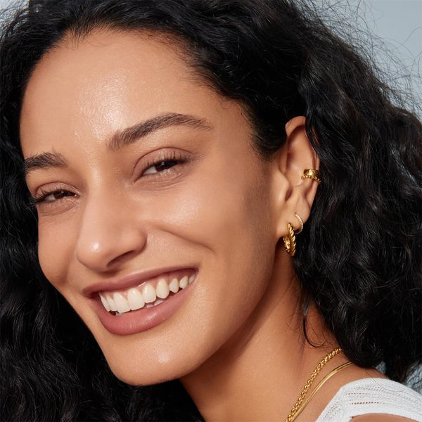 Ania Haie Gold Twisted Huggie Hoop Earrings Image 2 Peter & Co. Jewelers Avon Lake, OH