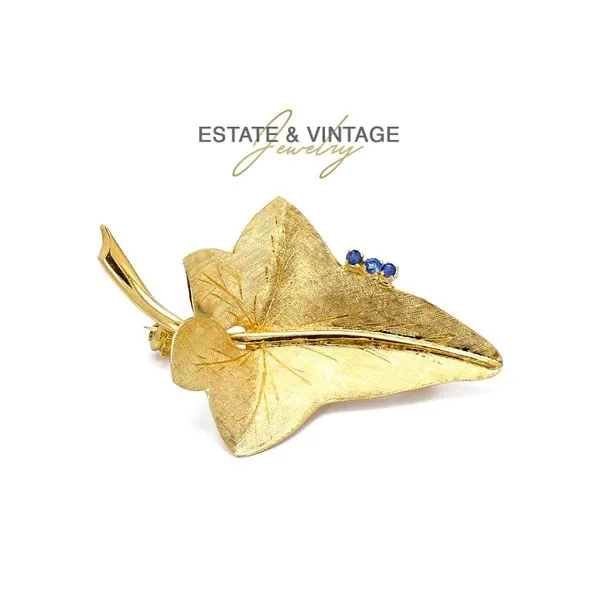 Estate 18K Yellow Gold Leaf Brooch Pin with Blue Sapphires Raleigh Diamond Fine Jewelry Raleigh, NC