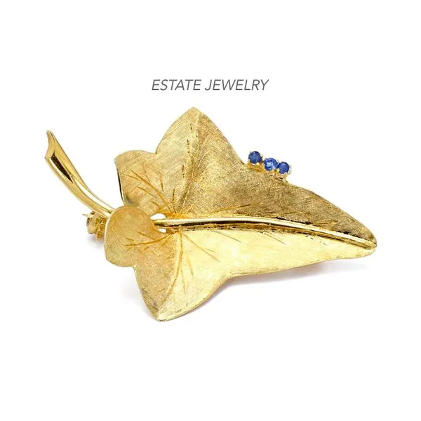 Estate 18K Yellow Gold Leaf Brooch with Blue Sapphires Raleigh Diamond Fine Jewelry Raleigh, NC