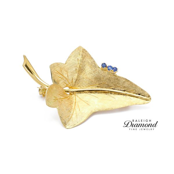 Estate 18K Yellow Gold Leaf Brooch with Blue Sapphires Raleigh Diamond Fine Jewelry Raleigh, NC