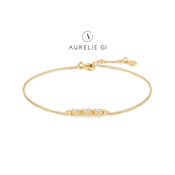 Aurelie Gi 14K Yellow Gold Permanent Bracelet with White Sapphire Baguette Raleigh Diamond Fine Jewelry Raleigh, NC