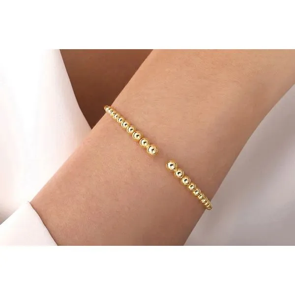 14K Yellow Gold Bujukan Open Flexible Bangle Bracelet Image 4 Raleigh Diamond Fine Jewelry Raleigh, NC