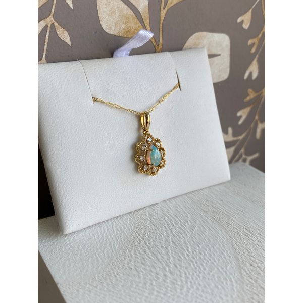 YELLOW GOLD NATURAL OPAL TEARDROP CABOCHON WITH A DIAMOND HALO PENDANT Image 2 Sam Dial Jewelers Pullman, WA