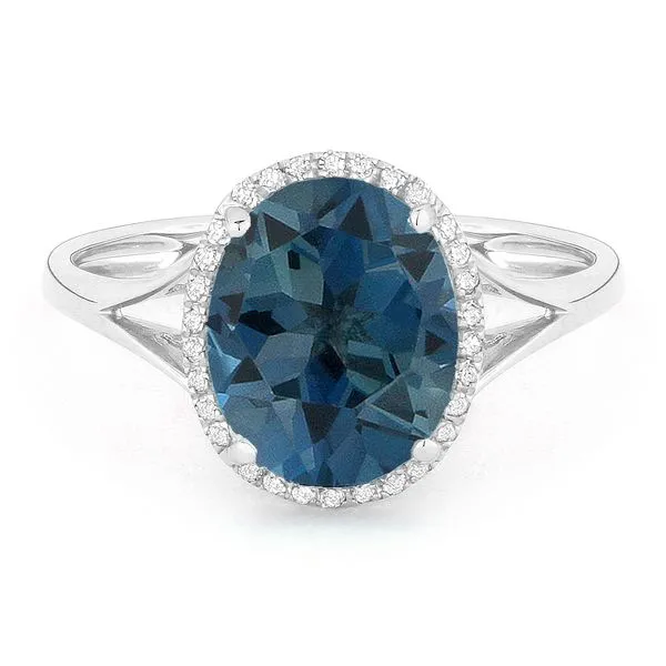 Madison L White 14 Karat Fashion Ring With Oval Blue Topazs And 30=0.10Tw Round Diamonds Steve Lennon & Co Jewelers  New Hartford, NY