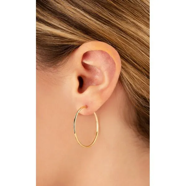 14 Karat Yellow Medium Hoop Earrings - 1.5x30mm Image 2 Carroll's Jewelers Doylestown, PA
