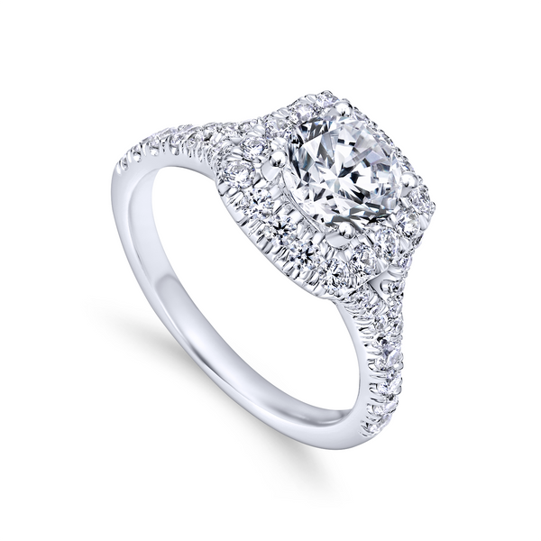 Pave diamonds adorn the band and halo of this classically elegant diamond engagement ring crafted from luxurious white gold The Ring Austin Round Rock, TX