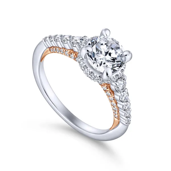 A string of graduated round diamonds adorns the reverse tapered band of this polished round cut engagement ring with a pop of rose gold shining from b The Ring Austin Round Rock, TX