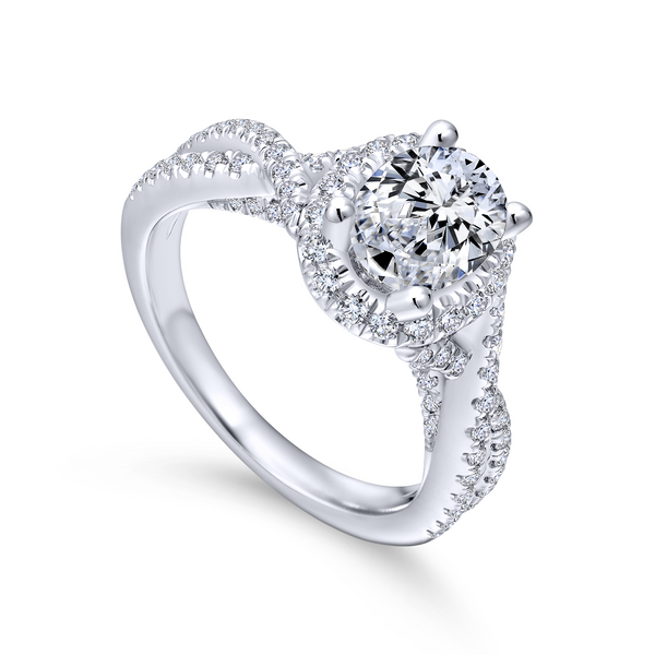Overlapping strands of pave diamonds twist up toward the center stone of this enchanting white gold engagement ring w/ oval fram The Ring Austin Round Rock, TX