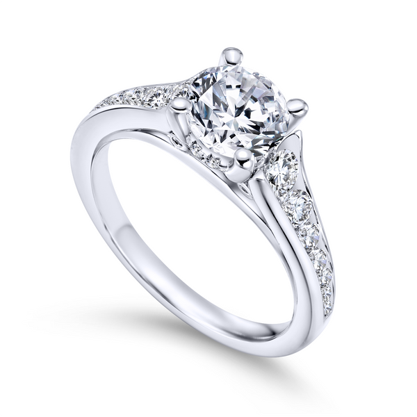 Channel of tapering round diamonds leads the eye right to your gorgeous center stone in this modern white gold engagement ring The Ring Austin Round Rock, TX