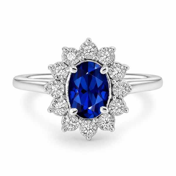 Sterling Silver Halo Ring Featuring an Oval Created Sapphire and Round Diamonds The Source Fine Jewelers Greece, NY