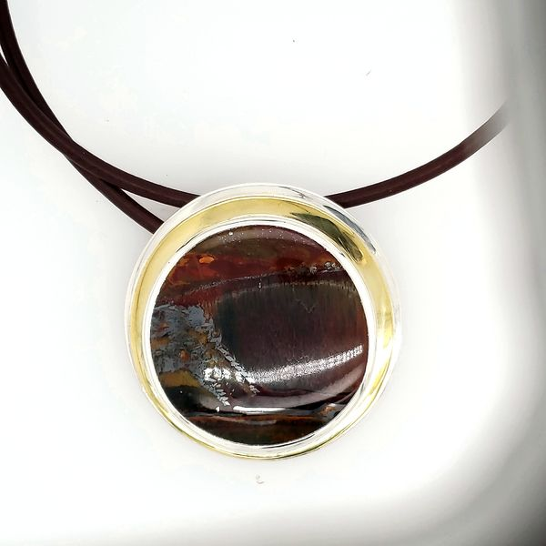 PATTI PAGE TIGERSEYE PENDANT SET IN SILVER AND BRASS ON A LEATHER CORD Van Scoy Jewelers Wyomissing, PA