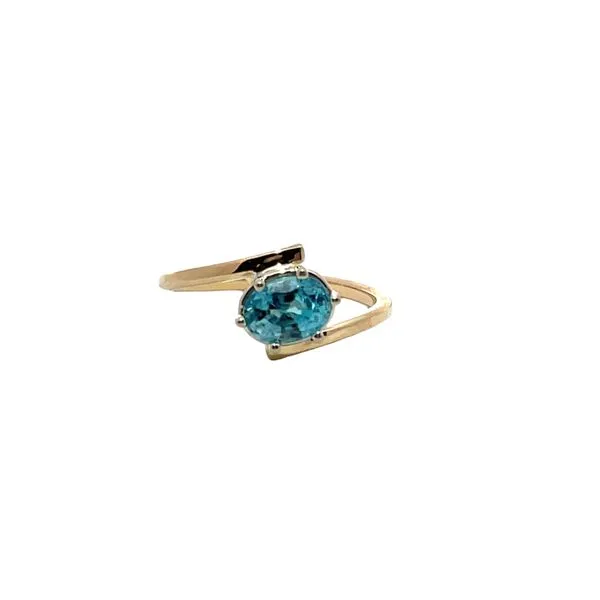 6.75, 14k YG Oval Blue Topaz Bypass Ring Vaughan's Jewelry Edenton, NC