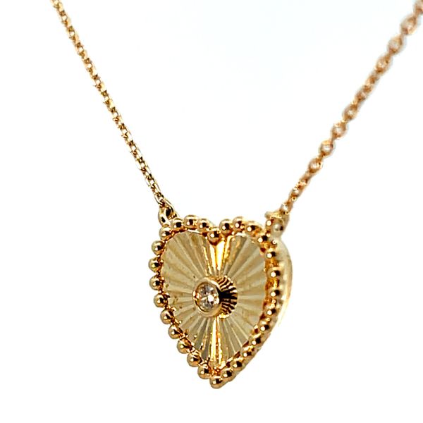 Lady's Yellow 10 Karat Starburst Heart Pendant with Round Diamonds Image 2 Venus Jewelers Somerset, NJ
