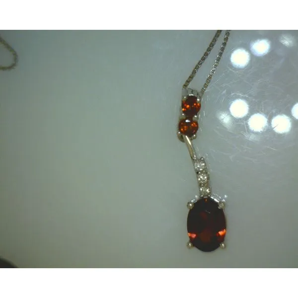 10KWG Oval Garnet Pendant W/ .045Ct I2/H Dia Accent Vulcan's Forge LLC KANSAS CITY, MO