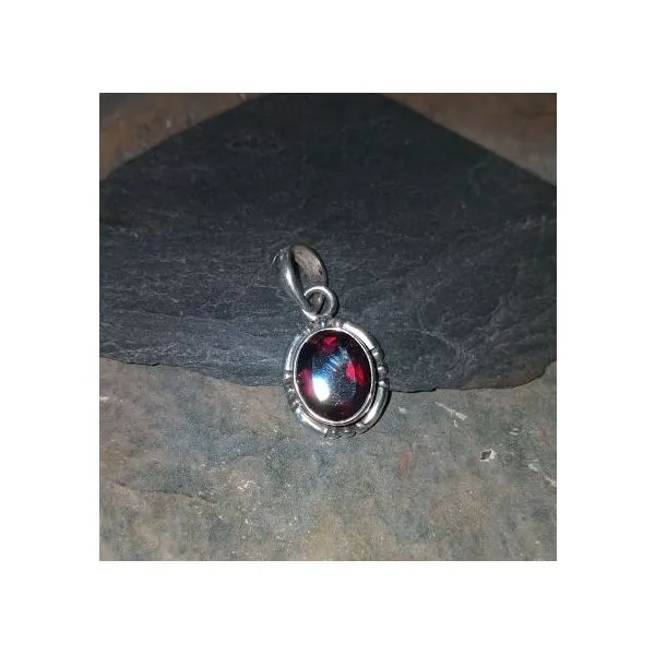 Faceted Oval Garnet in Bezel Set with Bead Detail Vulcan's Forge LLC KANSAS CITY, MO